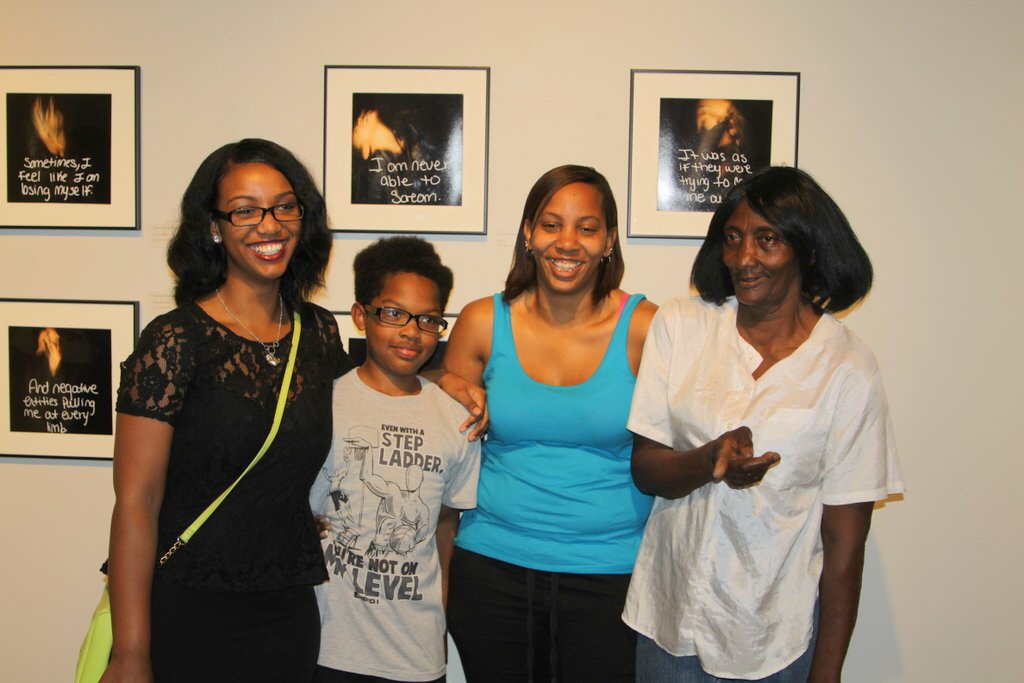 Jasmine Patterson with her brother, mother, and grandmother at her Senior Show Exhibition