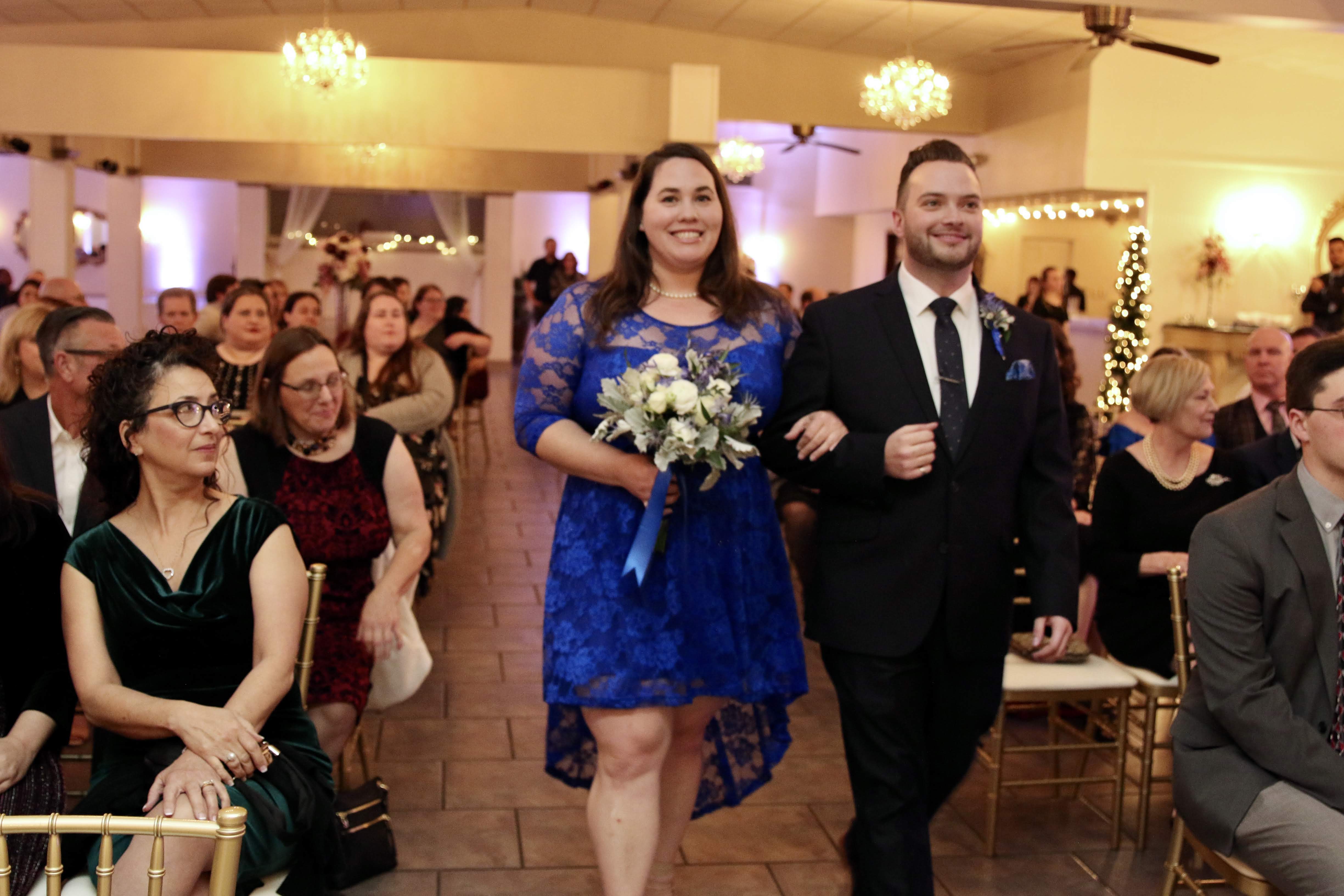Wedding party entering the reception hall