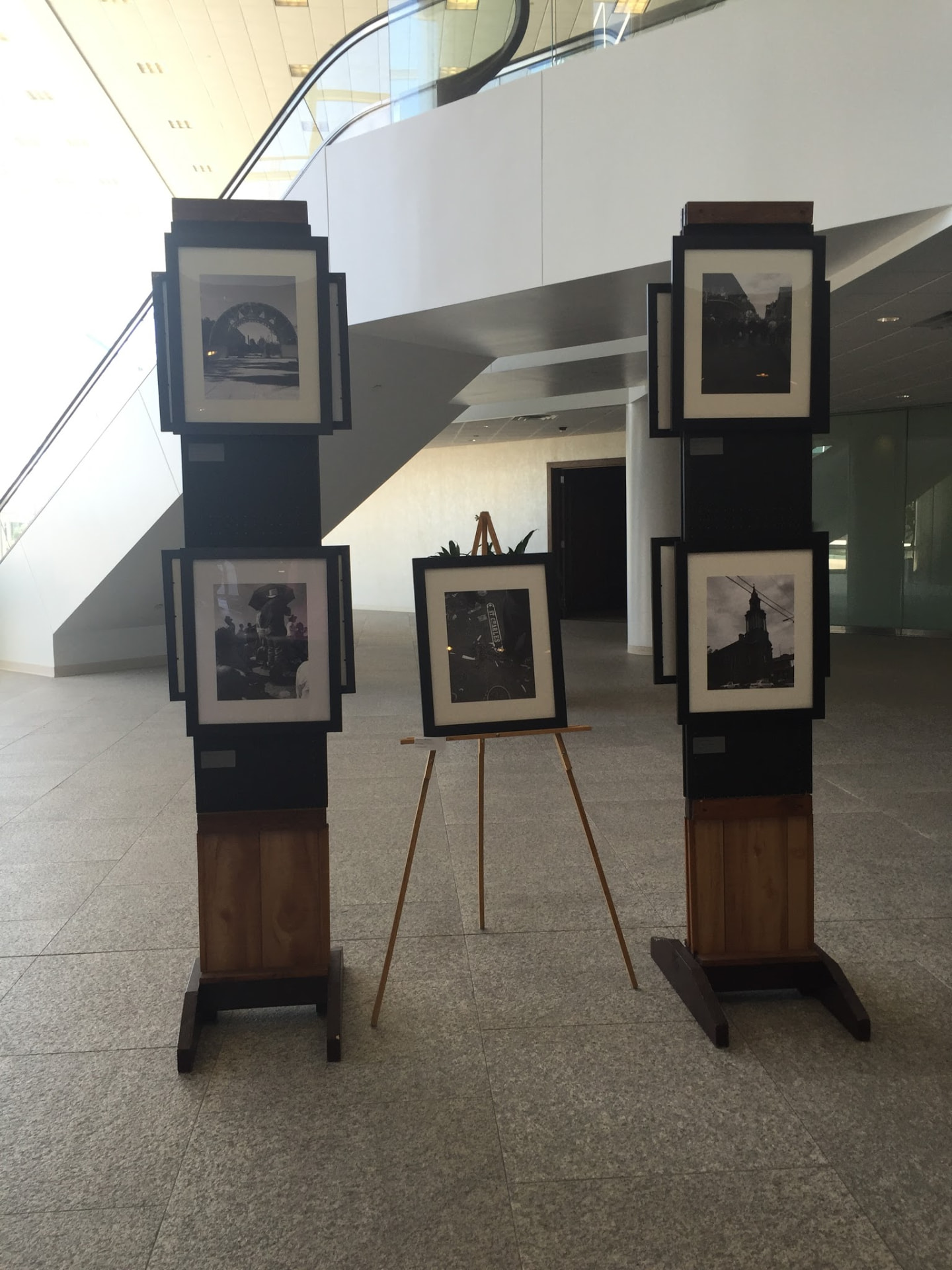 Framed black-and-white photographs on display at Louisiana; Unsolicited, Capital One Tower, 2016