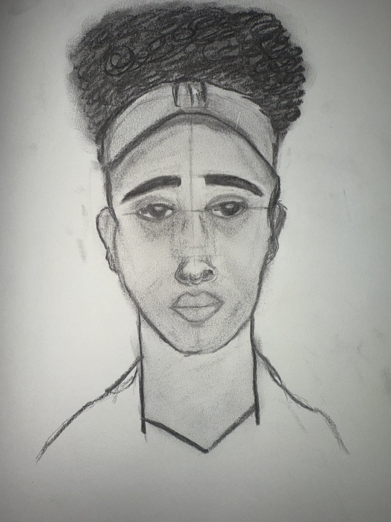 Graphite portrait of a young man with a headband and full hair