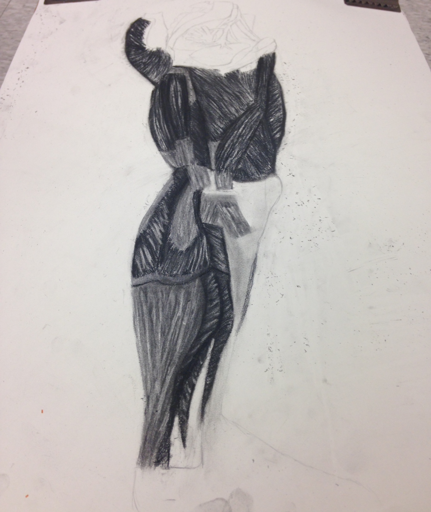 Charcoal figure study of a horned figure with defined musculature