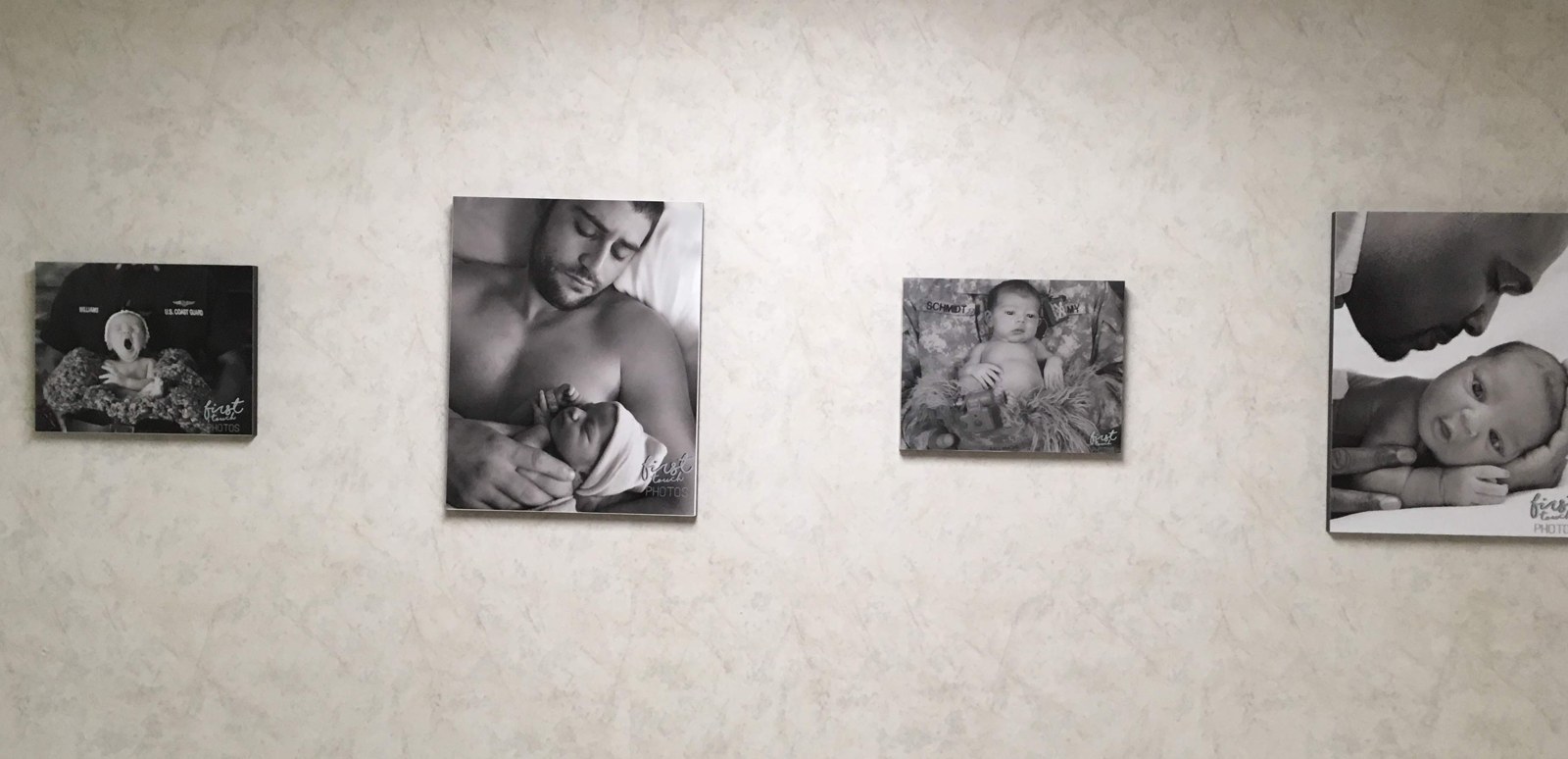 Continuation of the framed First Touch print display at the Little Miracles waiting room